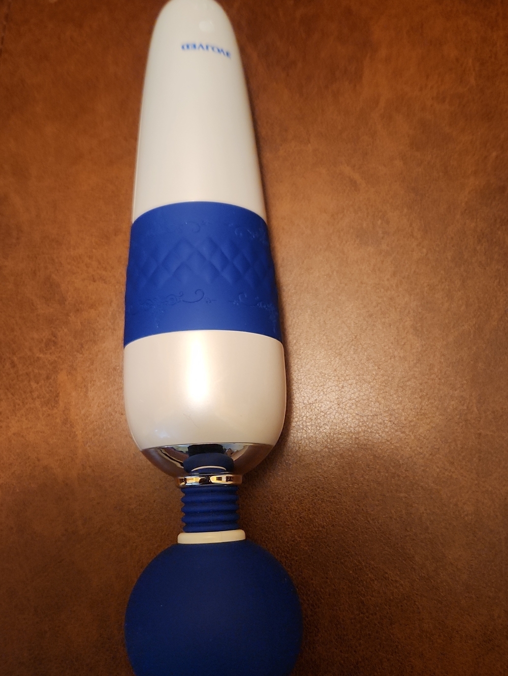 Blue and White Handheld Massager by (blank)